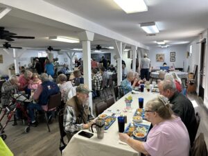 Dining room full of people eating